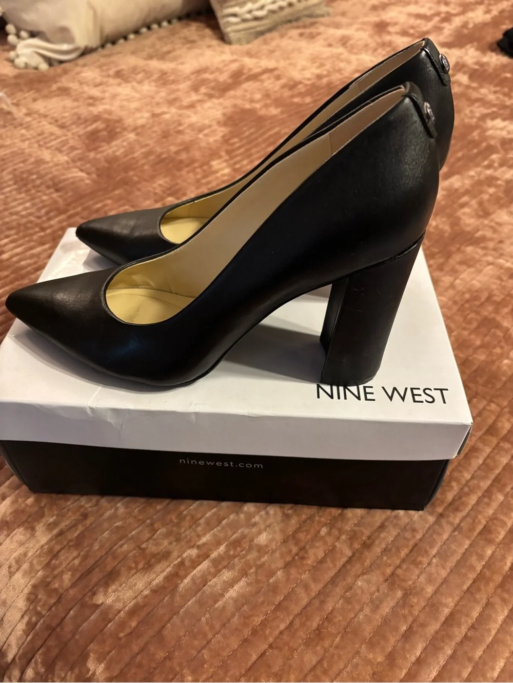 Nine West Astoria pumps in black leather, featuring a high block heel.